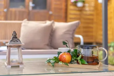 a tray of tea and an apple on a table at Giardino Privato & Comfort - Oasi di Relax a Roma in Rome
