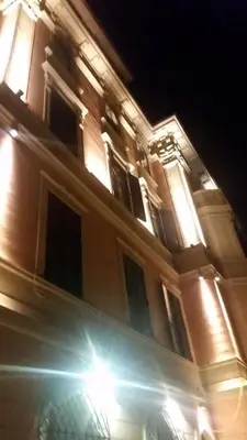 a building with a street light in front of it at night at Amalia Vatican House in Rome