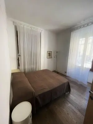 a bedroom with a bed and a toilet in it at Testaccio Stay - your home in the heart of Rome in Rome