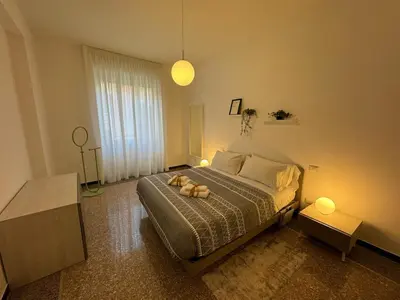 a bedroom with a bed with a teddy bear on it at Flaminia Apartment - Metro A in Rome