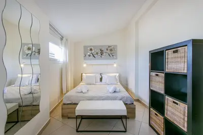 a small bedroom with a bed and a table at Terrazza San Pietro vicino metro A in Rome