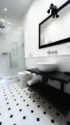 a bathroom with a sink and a toilet and a mirror at Dome View in Rome
