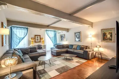 a living room with a couch and a table at Navona, 3 bedrooms, unique and spectacular view in Rome
