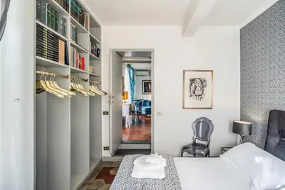 a bedroom with a bed and a chair at Navona, 3 bedrooms, unique and spectacular view in Rome