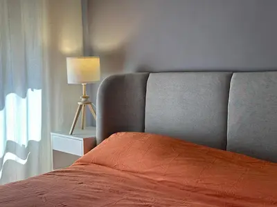a bedroom with a bed with a lamp and a window at La dolce vita in Rome - Guest House in Rome