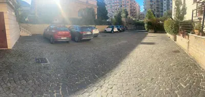 a group of cars parked in a parking lot at La terrazza di Baccio - Baccio's Terrace in Rome