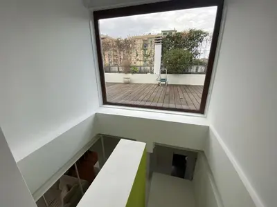 a room with a large window in a building at La terrazza di Baccio - Baccio's Terrace in Rome