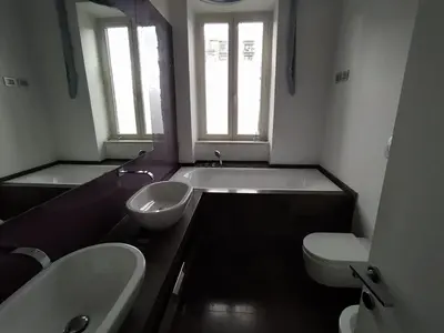 a bathroom with a tub and a toilet and a sink at La terrazza di Baccio - Baccio's Terrace in Rome