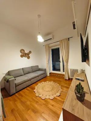 a living room with a couch and a table at La Casetta A Monti Di Creta in Rome