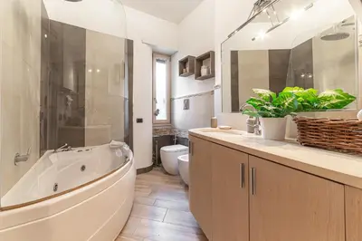 a bathroom with a tub and a toilet and a sink at Il Nido di Roma - Ospedale Gemelli & Garden in Rome