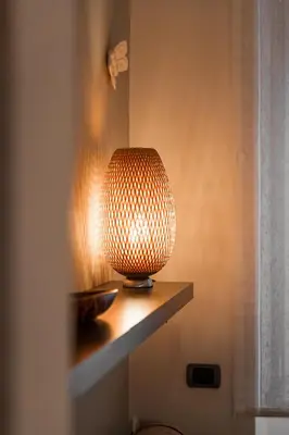 a lamp sitting on a shelf in a room at Il Nido di Roma - Ospedale Gemelli & Garden in Rome