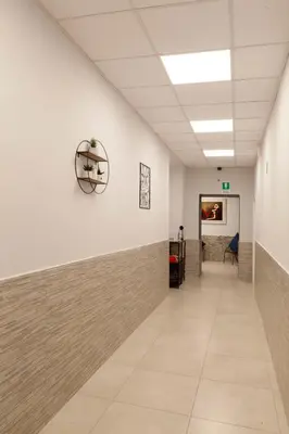 a hallway of an office building with a hallway at Ricky Home in Rome