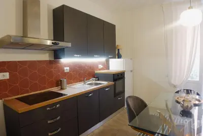 a kitchen with a sink and a counter top at Lussuosa Casa nel cuore di Trastevere in Rome