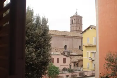 a view of a building with a clock tower at Lussuosa Casa nel cuore di Trastevere in Rome