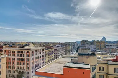 a view of a city with buildings at Luxury view on St Peter Basilica in Rome