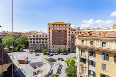 an aerial view of a city with buildings at Re Di Roma Retreat in Rome