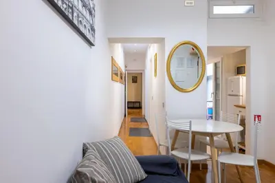a living room with a table and a mirror at Ombrellari Secret Terrace in Rome