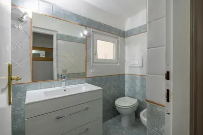 a bathroom with a sink and a toilet at Ombrellari Secret Terrace in Rome