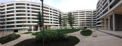 a large white building with trees in front of it at Modern Loft Private in Rome