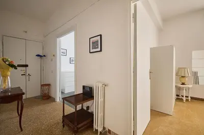 a living room with a radiator and a table at Domus Erasmo in Rome