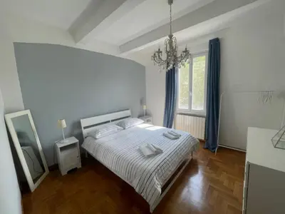 a white bedroom with a bed and a mirror at Appartamento casa Vittoria Centro citt vicino allo stadio olimpico in Rome
