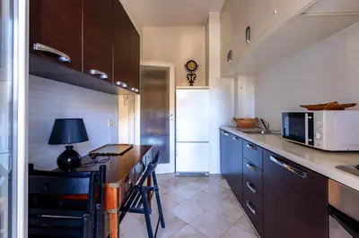 a kitchen with a counter top and a microwave at Casa di Sofia in Rome