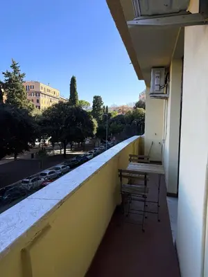 a balcony with a table and chairs on a building at Vatican Terrace in Rome