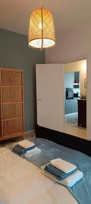 a room with two towels on a bed with a mirror at Nico's Apartment in Rome