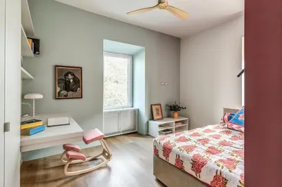 a bedroom with a bed and a desk and a window at 2 bedroom apartment Flaminio Vignola in Rome