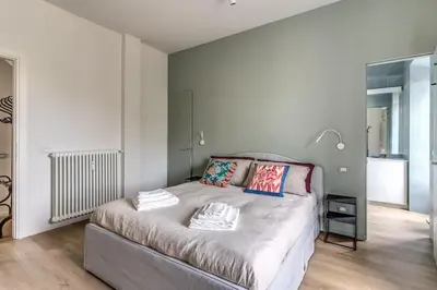 a bedroom with a bed with two pillows on it at 2 bedroom apartment Flaminio Vignola in Rome