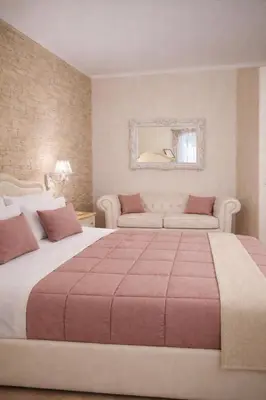 a bedroom with a large bed and a couch at RomAntic Dreams in Rome