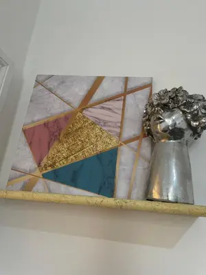a mirror on a shelf with a trophy on it at Termini Station Turati House by Dama in Rome