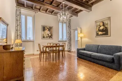 a living room with a couch and a table at Casa Iside in Rome