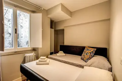 a bedroom with a bed and a window at Campo di fiori 2 bedroom int 4 in Rome