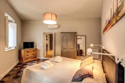 a bedroom with a bed with towels on it at Campo di fiori 2 bedroom int 4 in Rome
