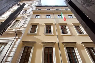 a building with a flag on the side of it at Leutari in Rome
