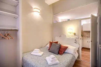 a bedroom with a bed with towels on it at Cappellari Campo dei Fiori int 3 in Rome