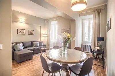 a living room with a table and a couch at Cappellari Campo dei Fiori int 5 in Rome