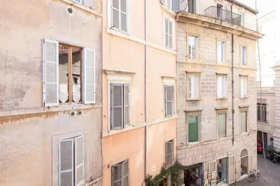 an old building with windows on the side of it at Cappellari Campo dei Fiori int 5 in Rome