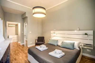 a bedroom with a large bed with towels on it at Cappellari Campo dei Fiori int 5 in Rome