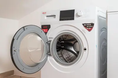 a washer and dryer in a laundry room at Vaticano-Metro A, Penthouse with AC, Wi-Fi e Netflix in Rome