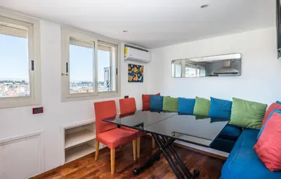a dining room with a glass table and chairs at Vaticano-Metro A, Penthouse with AC, Wi-Fi e Netflix in Rome