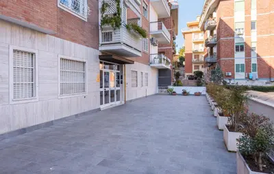 an empty courtyard in a apartment building at Vaticano-Metro A, Penthouse with AC, Wi-Fi e Netflix in Rome