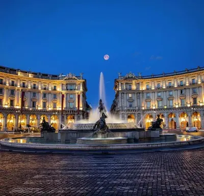 a large white building with a lot of windows at Domus Symmetrie in Rome
