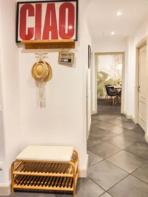 a hallway with a coda sign on the wall at 50mt Metro Station - 20min walking from Colosseum - RomeCentralHouse - Elegant and fully equipped in Rome