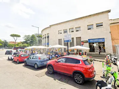 a group of cars parked in front of a building at 50mt Metro Station - 20min walking from Colosseum - RomeCentralHouse - Elegant and fully equipped in Rome