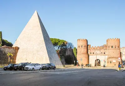 a castle with cars parked in front of it at 50mt Metro Station - 20min walking from Colosseum - RomeCentralHouse - Elegant and fully equipped in Rome