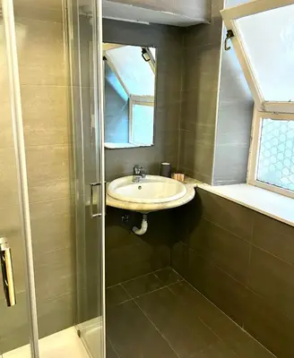 a bathroom with a sink and a mirror at Cellini apartments in Rome
