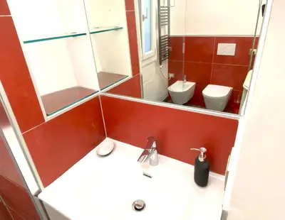 a bathroom with a sink and a toilet at Monti Lovely Suite in Rome
