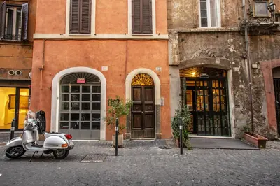a scooter parked in front of a building at Home-In-Rome in Rome